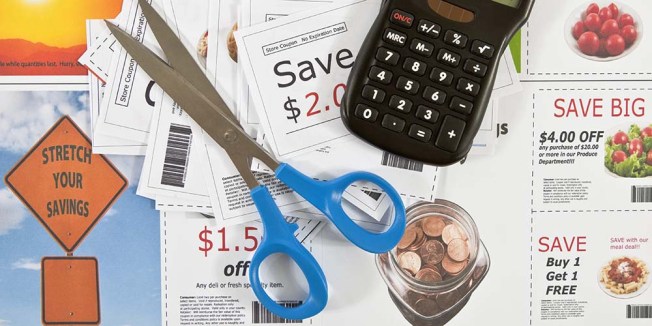 Person organizing coupons to save money on groceries and household items