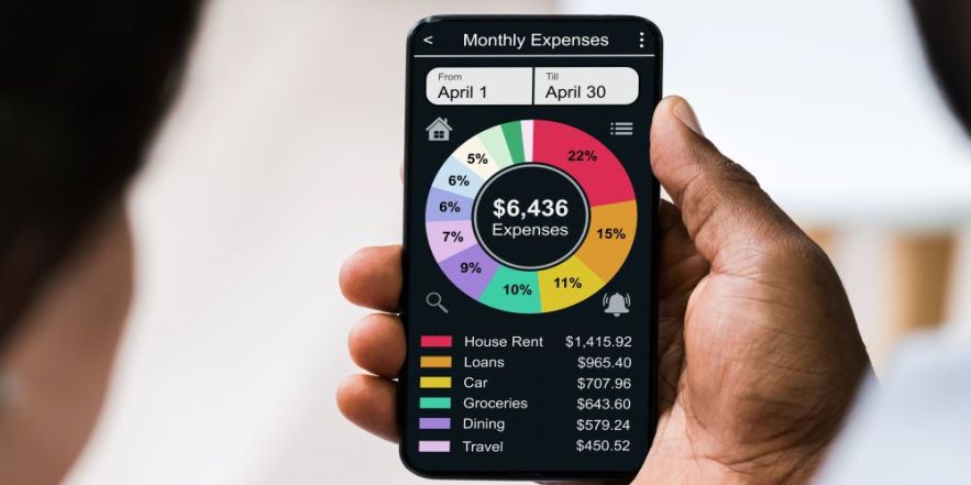 Person budgeting on a smartphone, showing how mobile apps help track spending and save money.