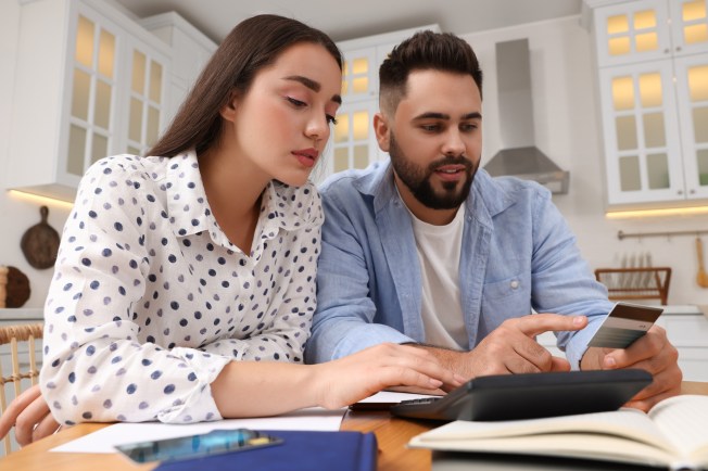 Woman and man applying online for a short-term loan to borrow quick cash from LendNation