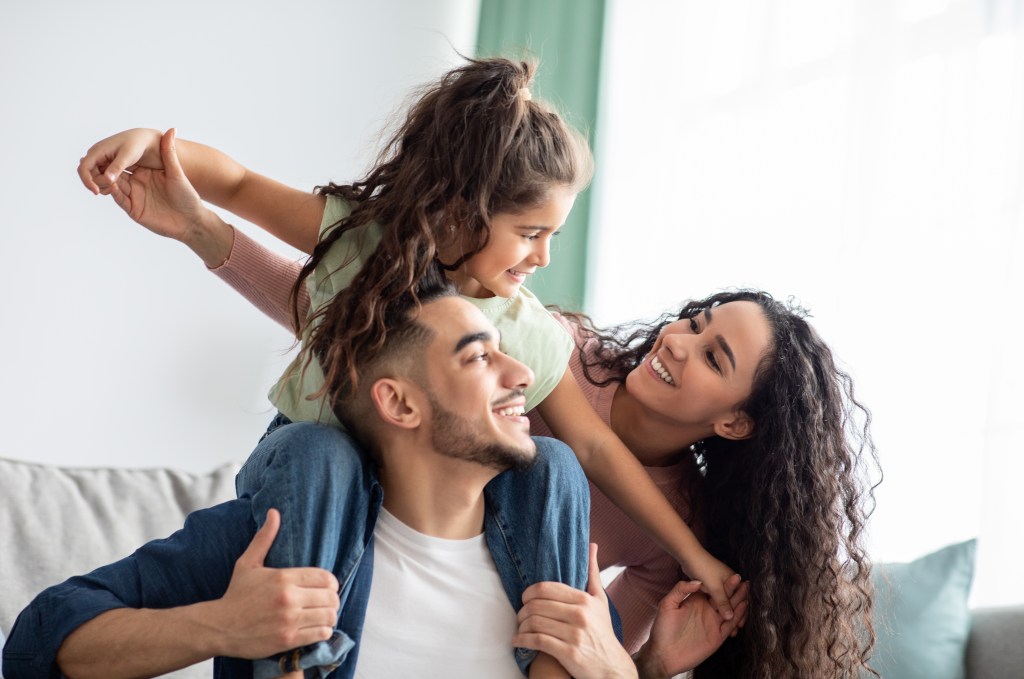 Parents playing with children