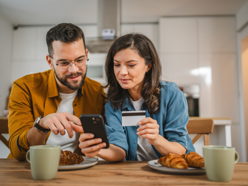 Person receiving loan funds on a debit card after LendNation approval