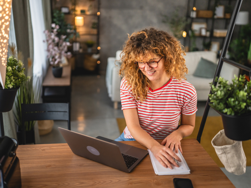 Person reviewing installment loan at home on their laptop.