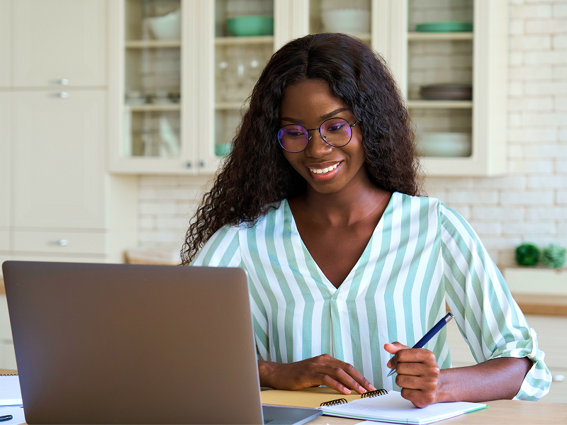 Woman reviewing loan application after approval.